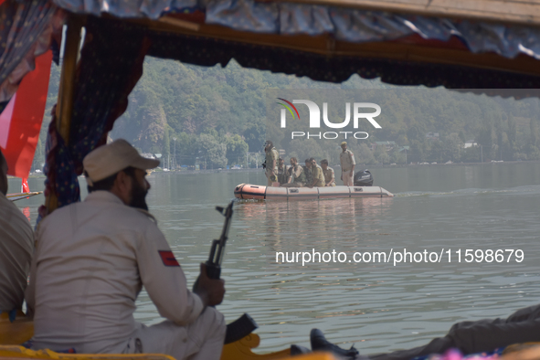 Indian troopers remain alert as the National Conference, a regional political party, holds a boat rally ahead of the second phase of assembl...