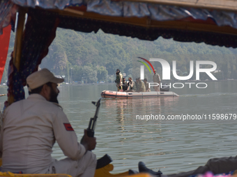 Indian troopers remain alert as the National Conference, a regional political party, holds a boat rally ahead of the second phase of assembl...