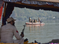 Indian troopers remain alert as the National Conference, a regional political party, holds a boat rally ahead of the second phase of assembl...