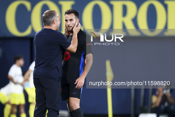 Head coach of FC Barcelona Hansi Flick (L) and Eric Garcia of FC Barcelona (R) during the La Liga match between Villarreal CF and FC Barcelo...