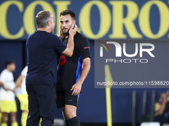 Head coach of FC Barcelona Hansi Flick (L) and Eric Garcia of FC Barcelona (R) during the La Liga match between Villarreal CF and FC Barcelo...