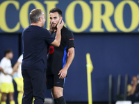 Head coach of FC Barcelona Hansi Flick (L) and Eric Garcia of FC Barcelona (R) during the La Liga match between Villarreal CF and FC Barcelo...