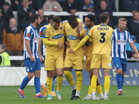 Josh Umerah of Dagenham & Redbridge celebrates with his teammates after scoring their first goal during the Vanarama National League match b...