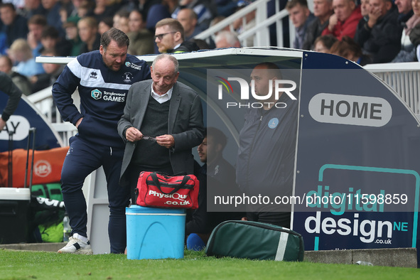 Hartlepool manager Darren Sarll and Lennie Lawrence converse in the dugout during the Vanarama National League match between Hartlepool Unit...