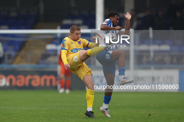 Sam Ling of Dagenham & Redbridge is in action with Hartlepool United's Roshaun Mathurin during the Vanarama National League match between Ha...