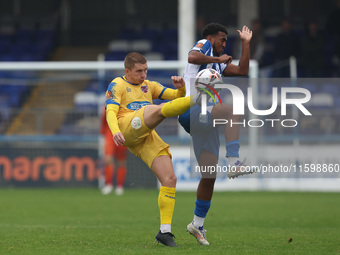 Sam Ling of Dagenham & Redbridge is in action with Hartlepool United's Roshaun Mathurin during the Vanarama National League match between Ha...