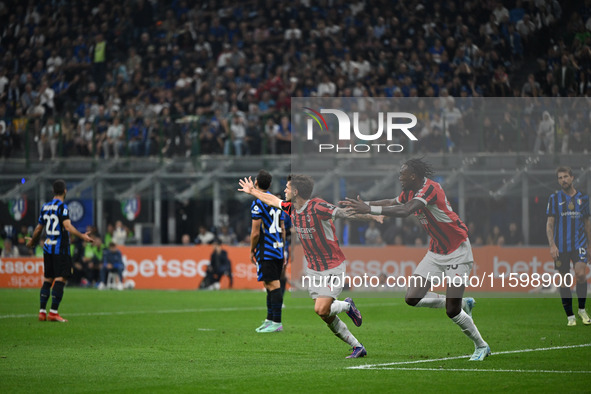 Christian Pulisic of AC Milan celebrates after a goal during the Italian Serie A football match between Inter FC and AC Milan in Milan, Ital...