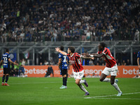 Christian Pulisic of AC Milan celebrates after a goal during the Italian Serie A football match between Inter FC and AC Milan in Milan, Ital...