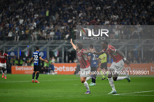 Christian Pulisic of AC Milan celebrates after a goal during the Italian Serie A football match between Inter FC and AC Milan in Milan, Ital...