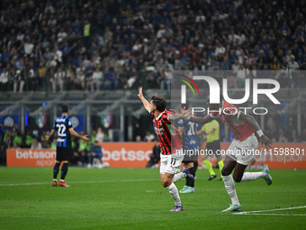 Christian Pulisic of AC Milan celebrates after a goal during the Italian Serie A football match between Inter FC and AC Milan in Milan, Ital...