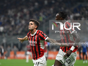 Christian Pulisic of AC Milan celebrates after a goal during the Italian Serie A football match between Inter FC and AC Milan in Milan, Ital...