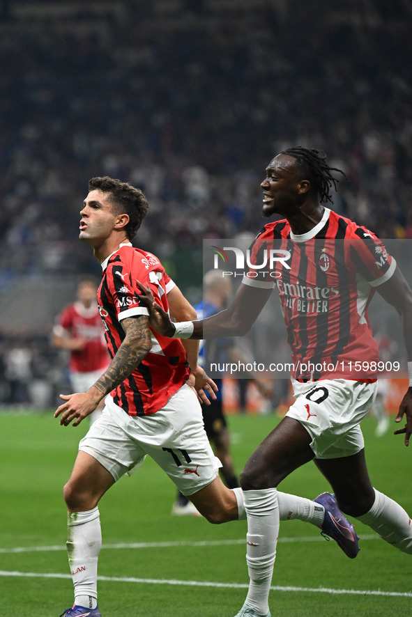 Christian Pulisic of AC Milan celebrates after a goal during the Italian Serie A football match between Inter FC and AC Milan in Milan, Ital...