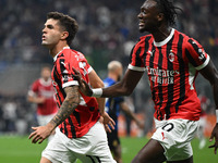 Christian Pulisic of AC Milan celebrates after a goal during the Italian Serie A football match between Inter FC and AC Milan in Milan, Ital...