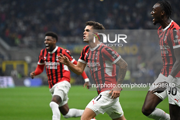 Christian Pulisic of AC Milan celebrates after a goal during the Italian Serie A football match between Inter FC and AC Milan in Milan, Ital...