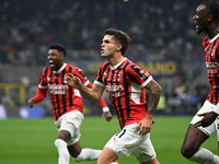 Christian Pulisic of AC Milan celebrates after a goal during the Italian Serie A football match between Inter FC and AC Milan in Milan, Ital...