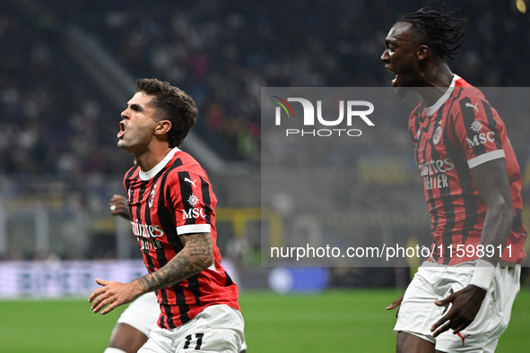 Christian Pulisic of AC Milan celebrates after a goal during the Italian Serie A football match between Inter FC and AC Milan in Milan, Ital...