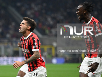 Christian Pulisic of AC Milan celebrates after a goal during the Italian Serie A football match between Inter FC and AC Milan in Milan, Ital...