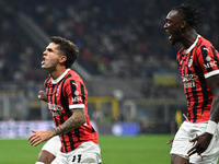 Christian Pulisic of AC Milan celebrates after a goal during the Italian Serie A football match between Inter FC and AC Milan in Milan, Ital...