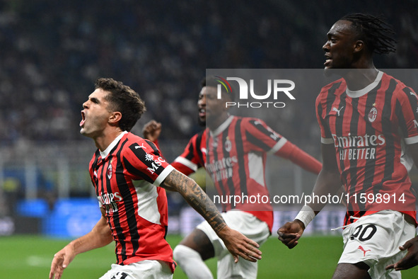 Christian Pulisic of AC Milan celebrates after a goal during the Italian Serie A football match between Inter FC and AC Milan in Milan, Ital...