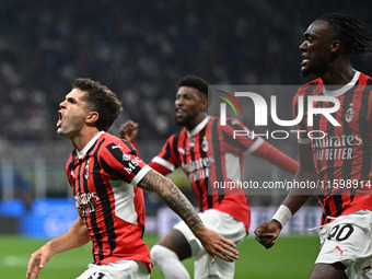 Christian Pulisic of AC Milan celebrates after a goal during the Italian Serie A football match between Inter FC and AC Milan in Milan, Ital...