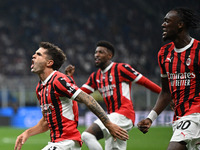 Christian Pulisic of AC Milan celebrates after a goal during the Italian Serie A football match between Inter FC and AC Milan in Milan, Ital...