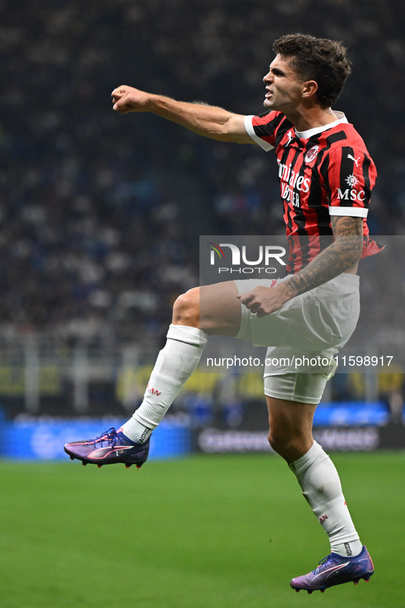 Christian Pulisic of AC Milan celebrates after a goal during the Italian Serie A football match between Inter FC and AC Milan in Milan, Ital...