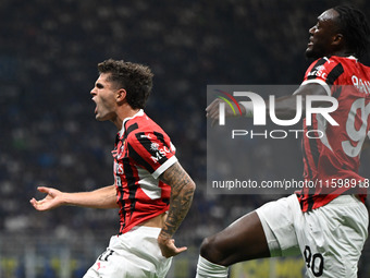 Christian Pulisic of AC Milan celebrates after a goal during the Italian Serie A football match between Inter FC and AC Milan in Milan, Ital...