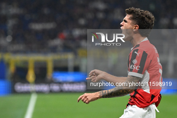 Christian Pulisic of AC Milan celebrates after a goal during the Italian Serie A football match between Inter FC and AC Milan in Milan, Ital...