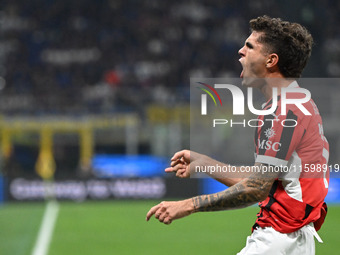 Christian Pulisic of AC Milan celebrates after a goal during the Italian Serie A football match between Inter FC and AC Milan in Milan, Ital...