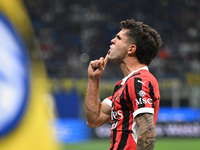 Christian Pulisic of AC Milan celebrates after a goal during the Italian Serie A football match between Inter FC and AC Milan in Milan, Ital...