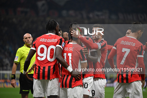 Christian Pulisic of AC Milan celebrates after a goal during the Italian Serie A football match between Inter FC and AC Milan in Milan, Ital...