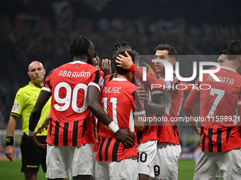 Christian Pulisic of AC Milan celebrates after a goal during the Italian Serie A football match between Inter FC and AC Milan in Milan, Ital...