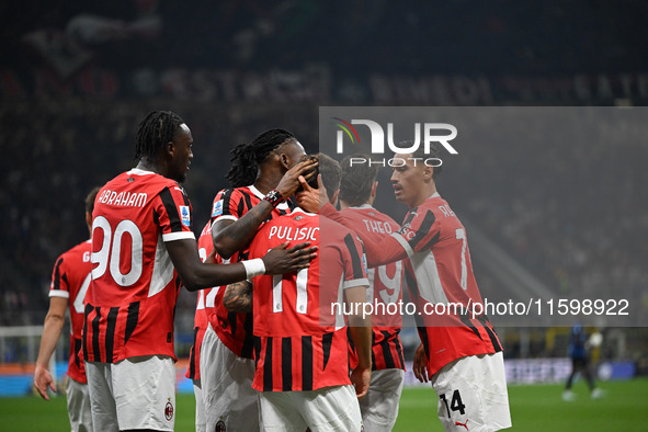 Christian Pulisic of AC Milan celebrates after a goal during the Italian Serie A football match between Inter FC and AC Milan in Milan, Ital...