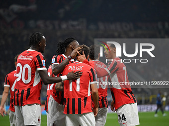 Christian Pulisic of AC Milan celebrates after a goal during the Italian Serie A football match between Inter FC and AC Milan in Milan, Ital...