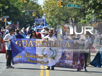 A general view of the 48th Queens Hispanic Parade 2024 marches down 37th Avenue, from 69th Street to 86th Street, through Jackson Heights, Q...