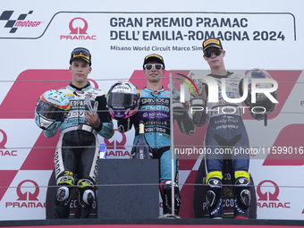 Angel Piqueras of Spain and Leopard Racing (L), David Alonso of Colombia and CFMOTO Aspar Team (C), and Collin Veijer of the Netherlands and...