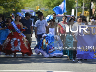 A general view of the 48th Queens Hispanic Parade 2024 marches down 37th Avenue, from 69th Street to 86th Street, through Jackson Heights, Q...