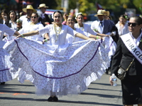 A general view of the 48th Queens Hispanic Parade 2024 marches down 37th Avenue, from 69th Street to 86th Street, through Jackson Heights, Q...