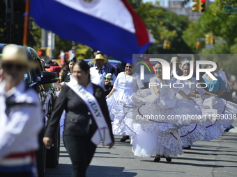 A general view of the 48th Queens Hispanic Parade 2024 marches down 37th Avenue, from 69th Street to 86th Street, through Jackson Heights, Q...