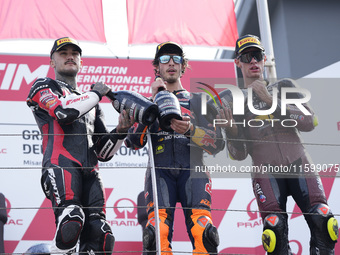 Aron Canet of Spain and Fantic Racing (L), Celestino Vietti of Italy and Red Bull KTM Ajo (C), and Tony Arbolino of Italy and ELF Marc VDS R...