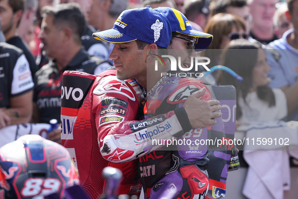 Enea Bastianini of Italy and Ducati Lenovo Team talks with Jorge Martin of Spain and Prima Pramac Racing at the end of the race of the MotoG...