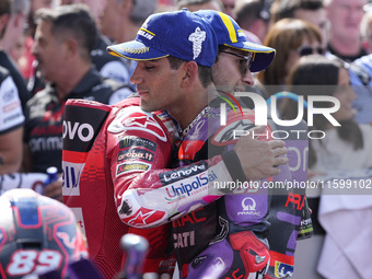 Enea Bastianini of Italy and Ducati Lenovo Team talks with Jorge Martin of Spain and Prima Pramac Racing at the end of the race of the MotoG...