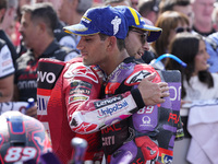 Enea Bastianini of Italy and Ducati Lenovo Team talks with Jorge Martin of Spain and Prima Pramac Racing at the end of the race of the MotoG...