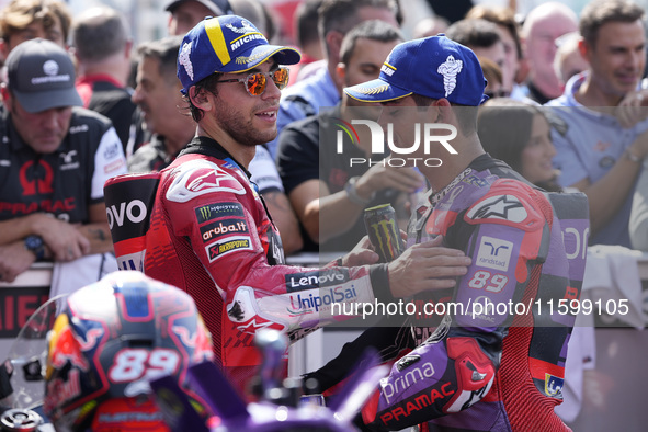 Enea Bastianini of Italy and Ducati Lenovo Team talks with Jorge Martin of Spain and Prima Pramac Racing at the end of the race of the MotoG...