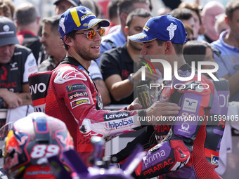 Enea Bastianini of Italy and Ducati Lenovo Team talks with Jorge Martin of Spain and Prima Pramac Racing at the end of the race of the MotoG...