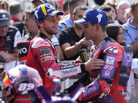 Enea Bastianini of Italy and Ducati Lenovo Team talks with Jorge Martin of Spain and Prima Pramac Racing at the end of the race of the MotoG...