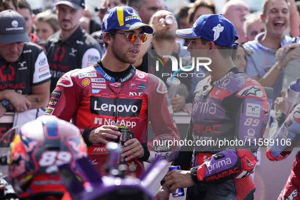 Enea Bastianini of Italy and Ducati Lenovo Team talks with Jorge Martin of Spain and Prima Pramac Racing at the end of the race of the MotoG...