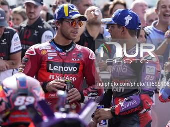 Enea Bastianini of Italy and Ducati Lenovo Team talks with Jorge Martin of Spain and Prima Pramac Racing at the end of the race of the MotoG...