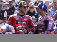 Enea Bastianini of Italy and Ducati Lenovo Team talks with Jorge Martin of Spain and Prima Pramac Racing at the end of the race of the MotoG...