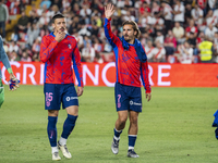 Clement Lenglet of Atletico de Madrid (L) and Antoine Griezmann of Atletico de Madrid (R) enter the field during the La Liga EA Sports 2024/...